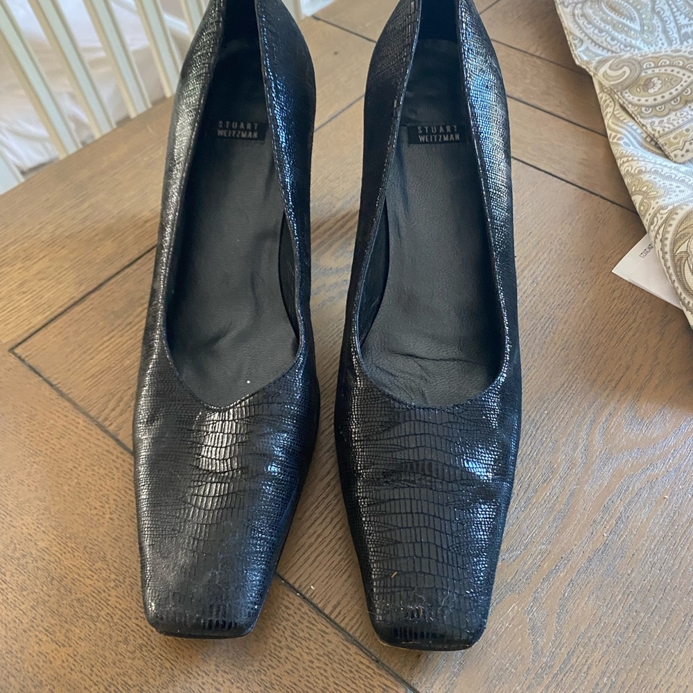Black pair Stuart Weizmann shoes